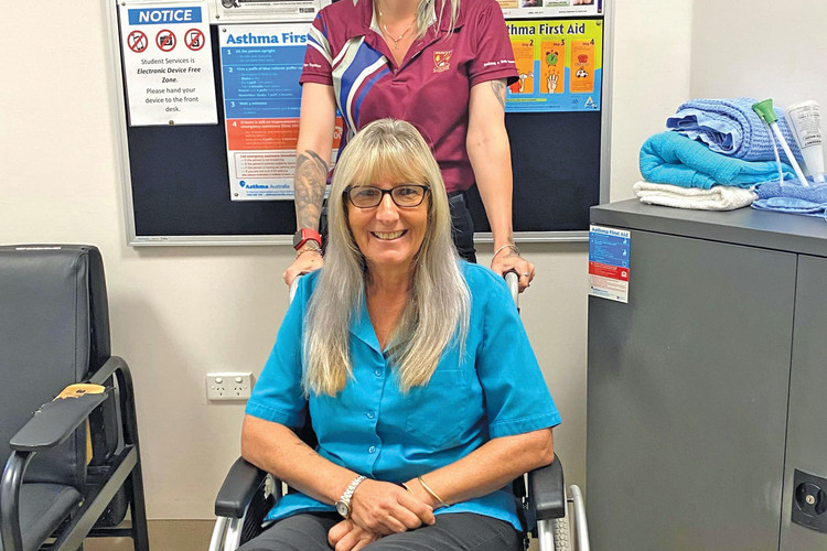 Mechelle Pell is saying goodbye to 16 years in the job and hitting the beach for her retirement, being “wheeled out” by new school first aid officer Chelsya Muller.