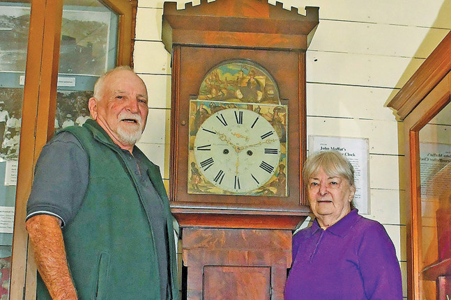 Peter Shimmin and Robyne Perkes with Moffat’s gradfather clock at the Loudoun House Museum at Irvinebank.