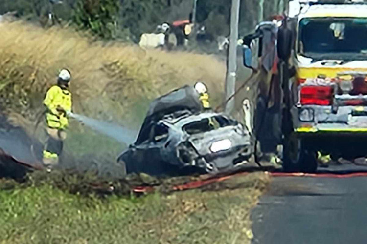 Firies attended the scene on Chettle Road to extinguish the police car fire.