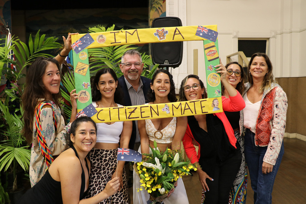 New Australian citizen Maria Garcia Menzella (pictured with bouquet) pictured with Maria’s friends and Douglas Shire Mayor Michael Kerr.