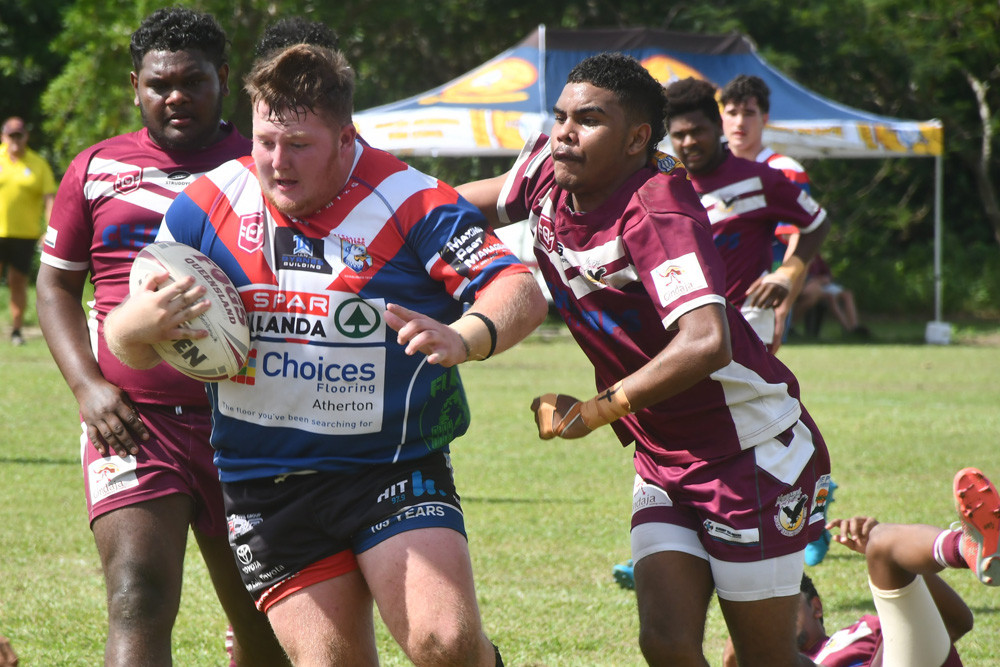 Roosters under 18 forward James Roberts hits the line at Yarrabah on Sunday.
