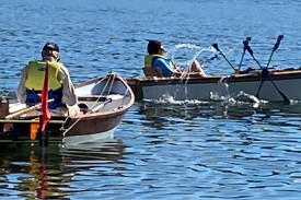 Chris O’Keefe leading the Peculiar Propulsion Race in his pedal-powered paddle-wheeler, followed by Dermot Smyth in his twin fishtail-powered craft.