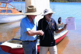 President of Sailability Cairns, Jeff Crofts, and Wooden Boat Association of Cairns Vice President, Chris O’Keefe, celebrating the donation of Om Toch to Sailability Cairns.