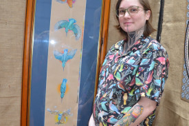 – Talented Mareeba artist Kristie Aquilina beside her coloured pencil piece, called “KING”, which took her more than 40 hours to complete and won her the Any Other Medium Award.