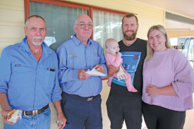 Millaa property owner, Michael Hoare, Dan Hampton and hosts Gordon and Tabitha Carcary, with little Darcy, enjoyed the sausage sizzle after the meeting.