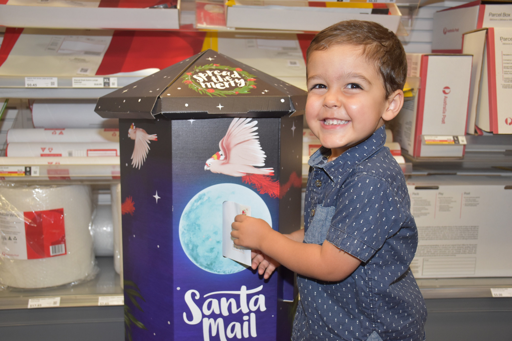Three year-old Braxton Malfitana posting his letter to Santa
