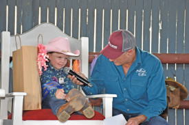 Mareeba Rodeo President Peter Brown talking with junior cowgirl winner Chelsea-lee Mitchell.