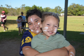 3.	Annabelle Extan and Kayden Extan watching their family perform at Dimbulah’s Naidoc celebrations.