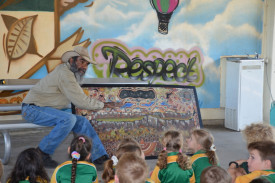 Dion Wason teaching young students, the meaning of tradition art.