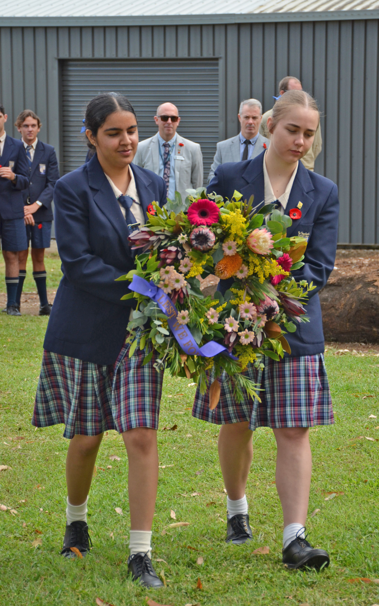 St Stephen’s Catholic College captains Manvir Kaur and Ella Daven laying the wreath.