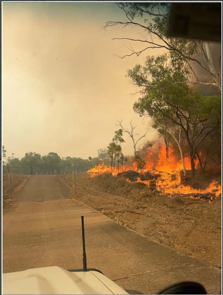 fire licks the road near Mt Molloy