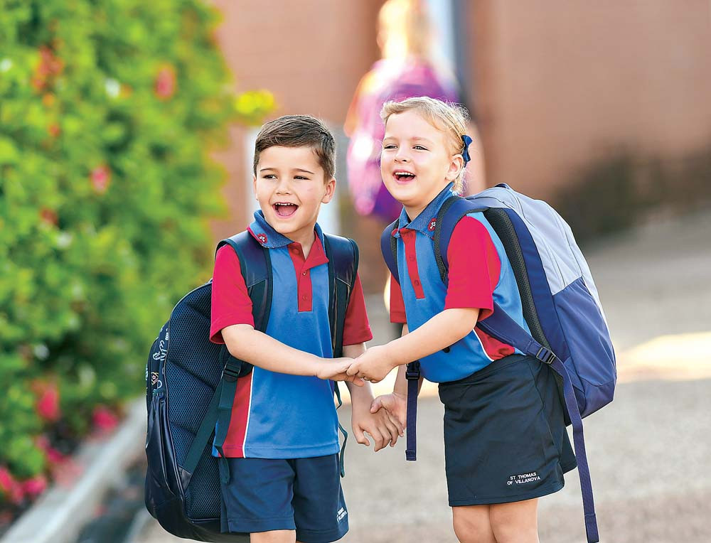 Youngsters Sonny Boney (left) and Lidia Boonzaaier couldn’t wait to start school on Friday at St Thomas of Villanova.