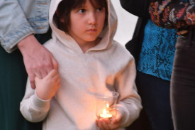 Seven-year-old Anika Wirth at last week’s candle light ceremony in Atherton.