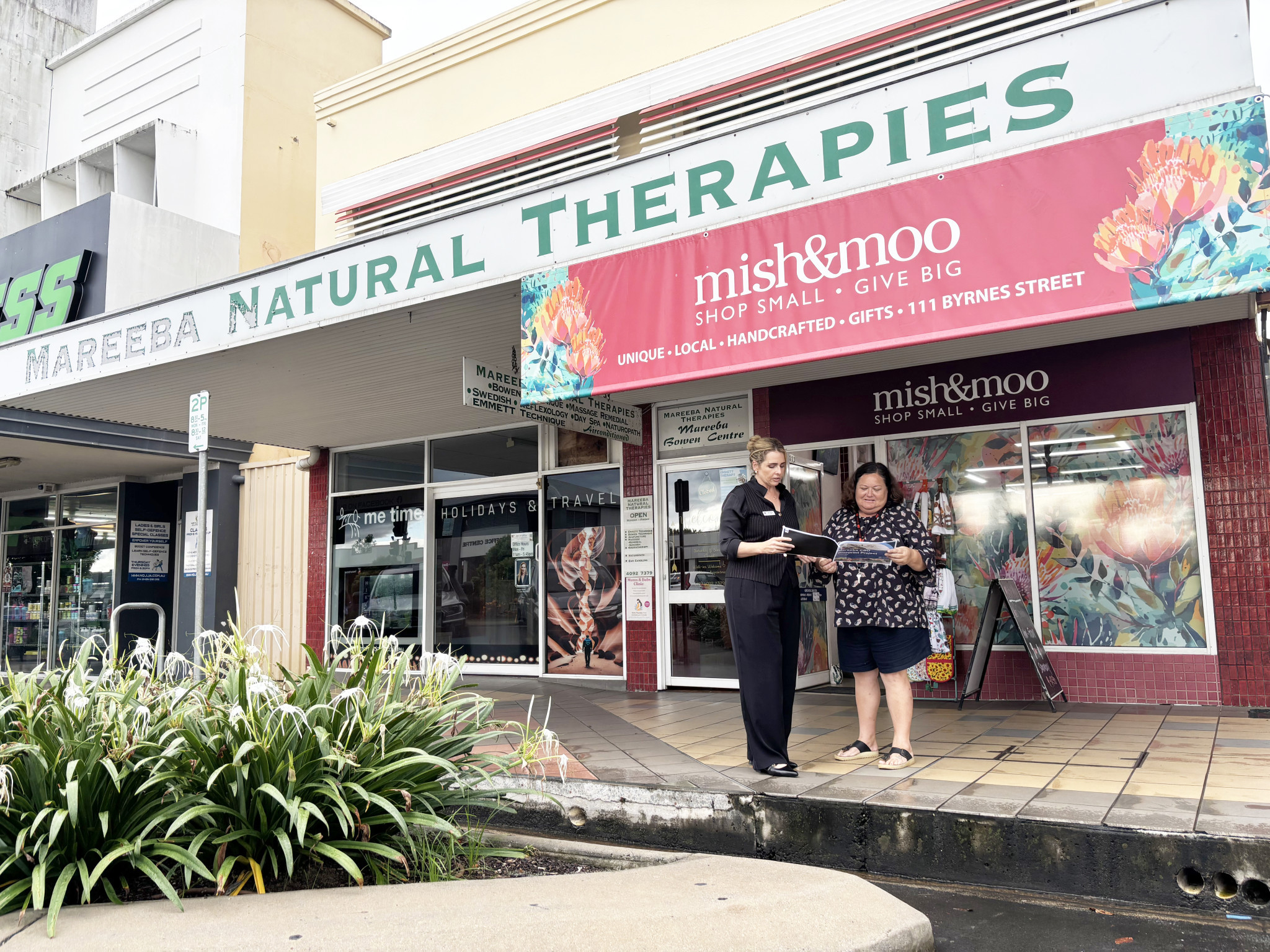 Cr Amy Braes (left) showing Mish & Moo owner Tammy Sivyer the final CBD blueprint.