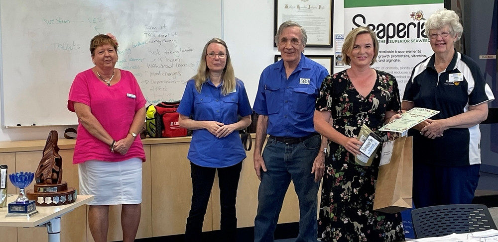 (from left) Cr Annette Haydon (judge), Liz Atkins (sponsor Seaperia), Grahame West (sponsor Seaperia), with Brittany Pearce of Malanda Primary School receiving her prize from Atherton Rotary Club president Leigh Woltmann.
