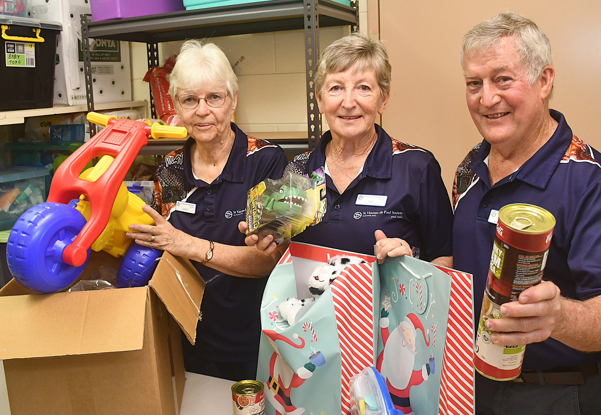 Atherton St Vincent de Paul members (from left) Lesley Webster and Sue Garland with Atherton conference president Kevin Garland at the hamper packing.