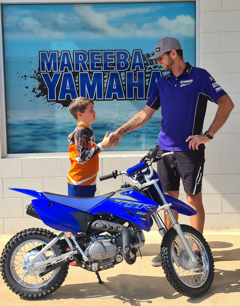 Harley Lane purchasing his first motorbike from Kim Grothues at Mareeba Yamaha.