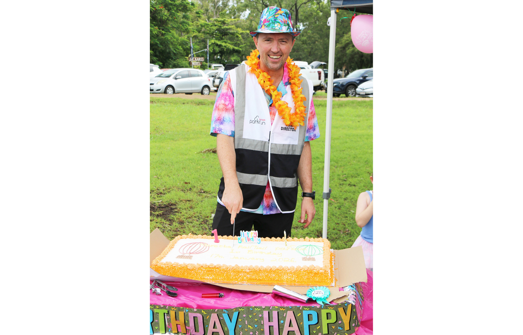 Event director Dr Nathan Walmsley cuts the birthday cake.