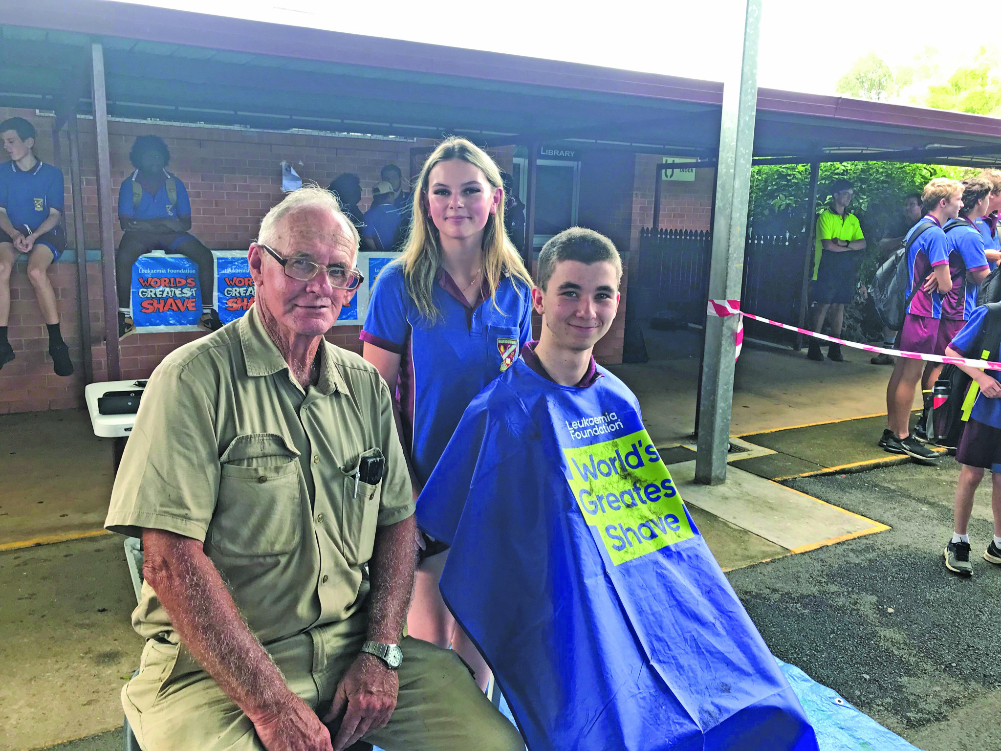 AFTER: Tom Mitchell and Saxon Turner have their hair shaved by student and hairdressing apprentice Zoe Brady.