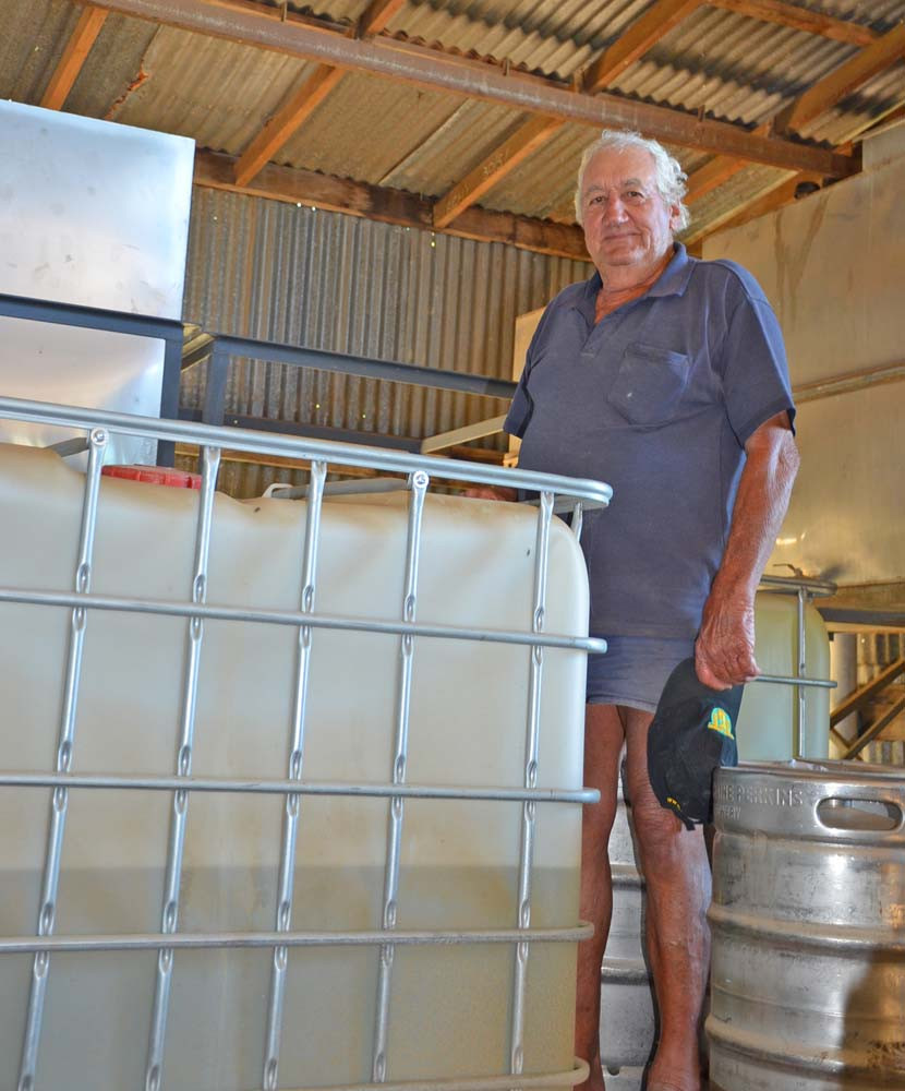 Makse Srhoj with some of the 12,000 litres of stockpiled oil.