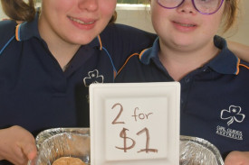 Atherton Girl Guides Emma Standen and Josepheene McKendry selling cookies.