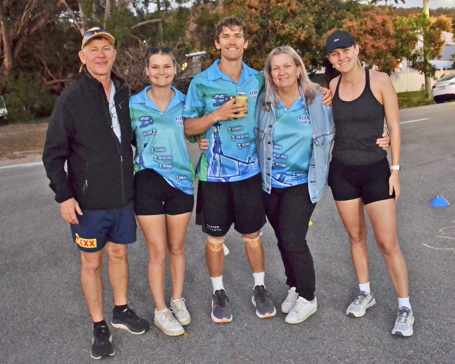 Lachlan with his parents and two sisters after his run.