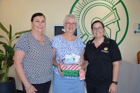Mareeba Leagues Club CEO Lucy Connor and financial manager Tracy Myrteza with Christmas promotion winner Julie Gillman (centre).