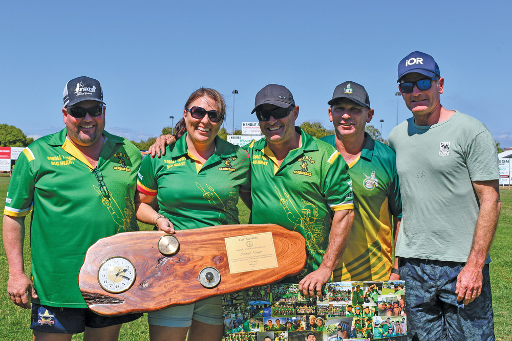 Rob McCarthy, Tony Martin and Rob Miller presenting 2022 Life Member Rachael Morgan and 2021 Life Member Brett Crooks (centre) with their award.