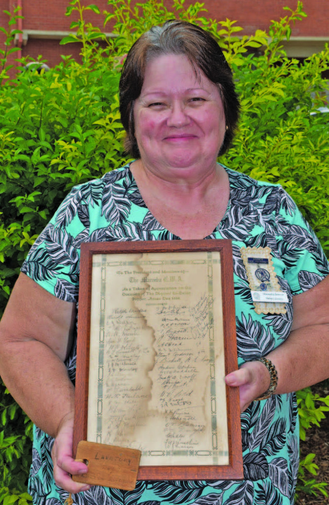 Helen holds the special thank you letter signed by all the servicemen from Mareeba who served in the First World War.