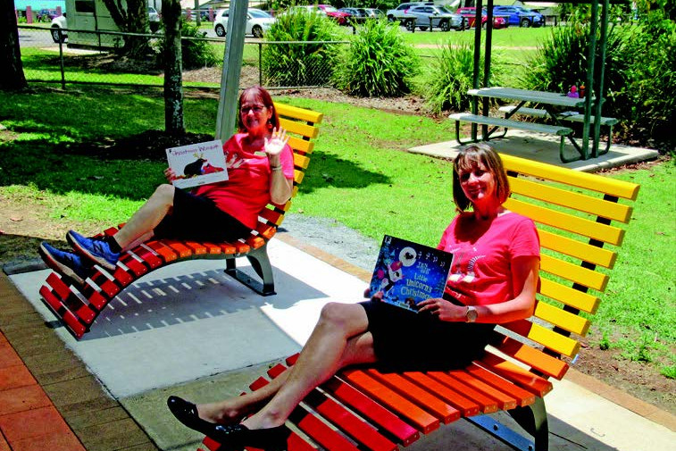 Karen Johnson and Rachel Raisin enjoying the new outdoor reading seats at Atherton Library.