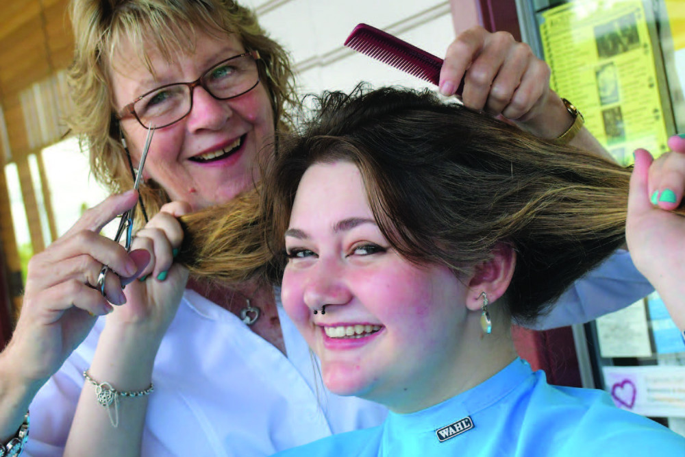Malanda girl Nikki Brown went bald for cancer research with hairdresser Janette Garbowski.