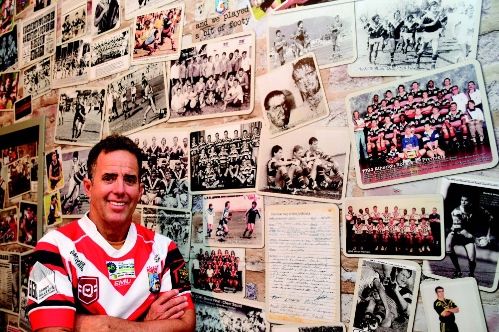 HISTORY: Gallery 5 owner Richard (Rick) Hastie in front of the new Atherton Roosters wall inside his café in Atherton.