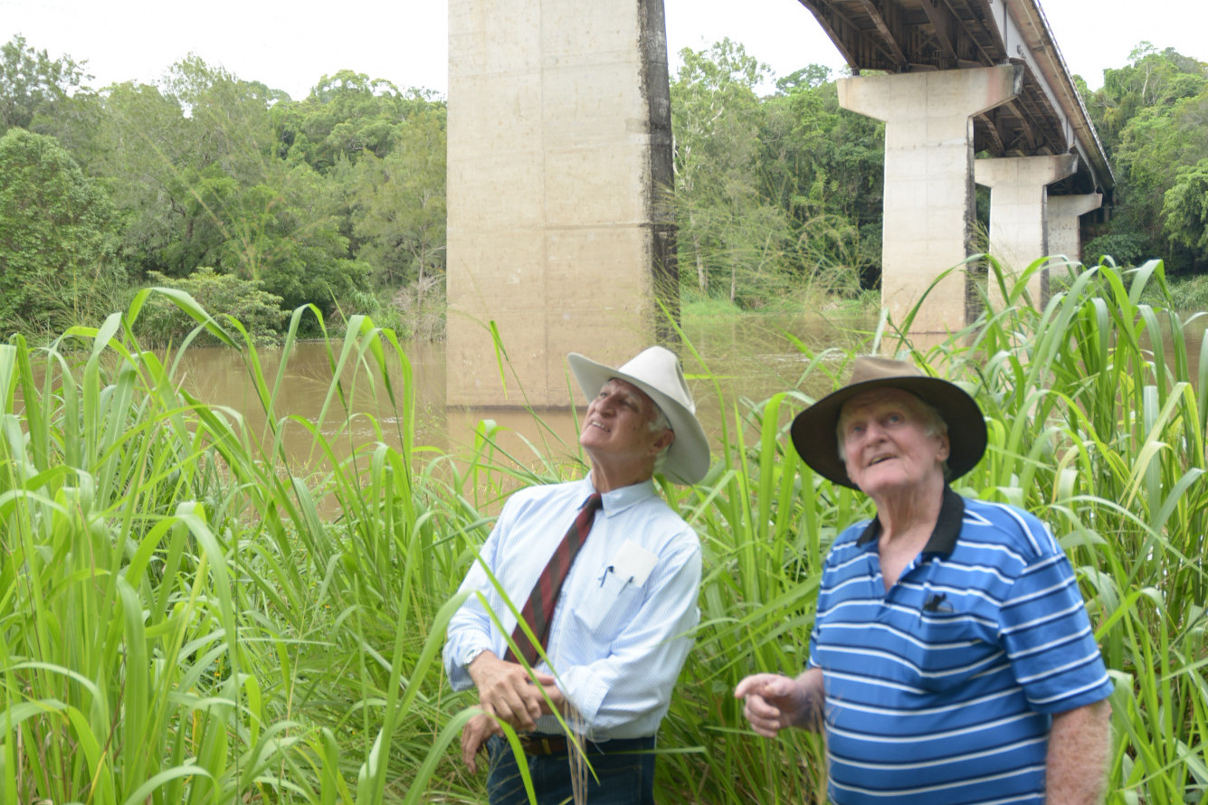 Kennedy MP Bob Katter Inspecting under the Barron River Bridge with Local Miner and road designer Ron Reddicliffe