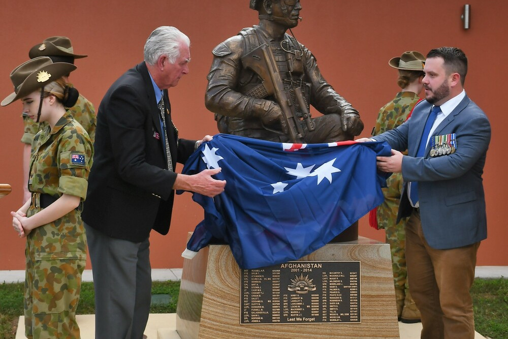 Atherton RSL sub branch president Rob Moss and Shadow Minister for Defence Phillip Thompson unveils the Afghanistan conflict monument on Sunday.