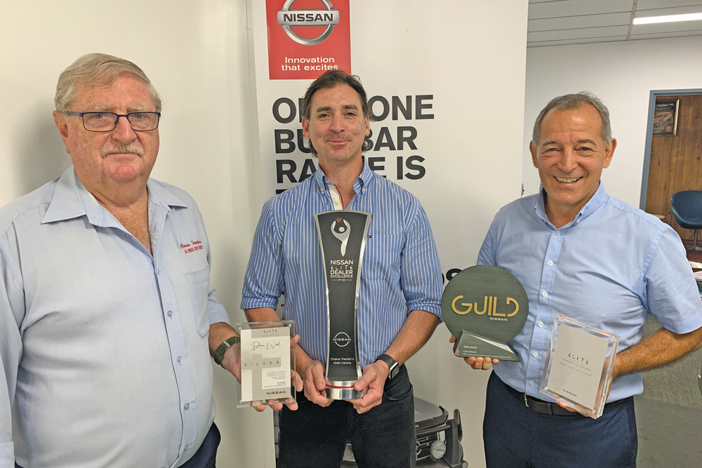 Sales representative Dan Wood (left) with All Wheel Drive Centre dealer principal Leon Trentin and Con Spanos with the awards.