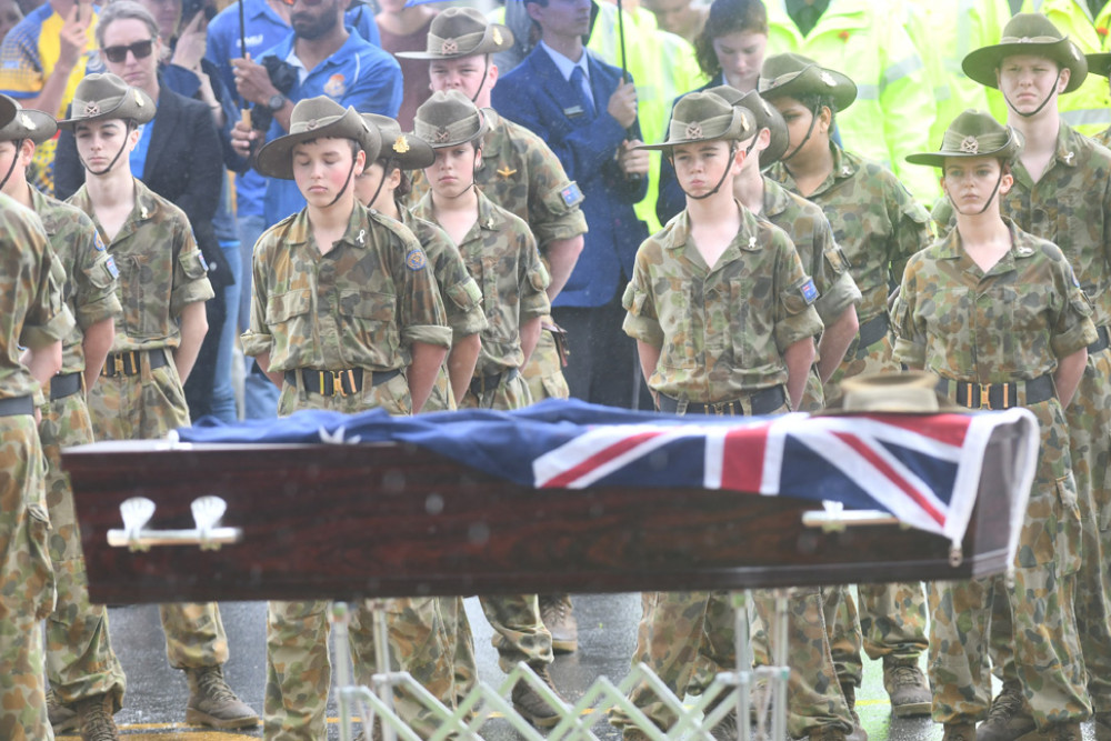 Malanda’s ceremony featured a coffin representing the “forgotten soldiers