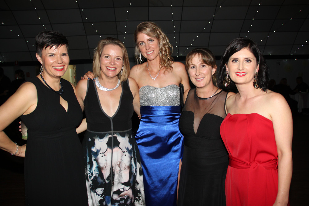 Pam Sly, Gail Barton, Lynda Wood, Jess Bennett and Mandy McCann had a ball at the Malanda Show Ball.