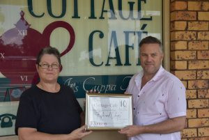 Vicki Milson from the Cottage cafe at Tolga accepting the award for best Fish and Chips on the Tablelands from the Express Newspapers Phil Brandel.