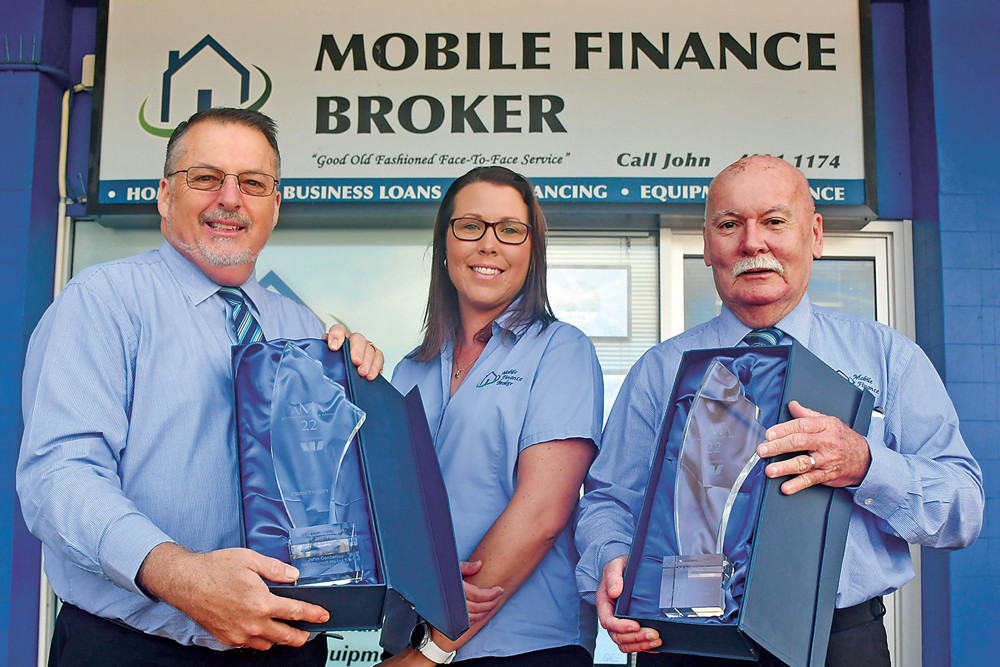 Mobile Finance Broker was named Brokerage of the Year at the 2022 Australian Mortgage Awards while broker John Contarino was named Regional Broker of the Year. Pictured is John with his award, practice manager Tracy Robertson and other broker Tony Carroll holding the brokerage award.