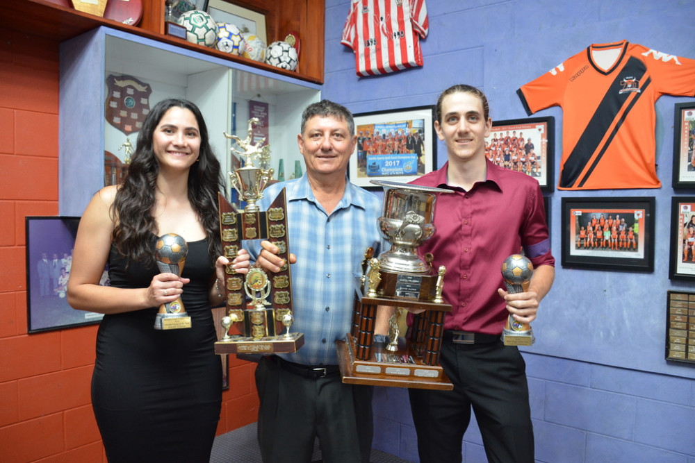 Ladies and Mens Player of the Year, Sarah Clark and Liam Pozzebon with MUFC president Mario Ghensi (centre).