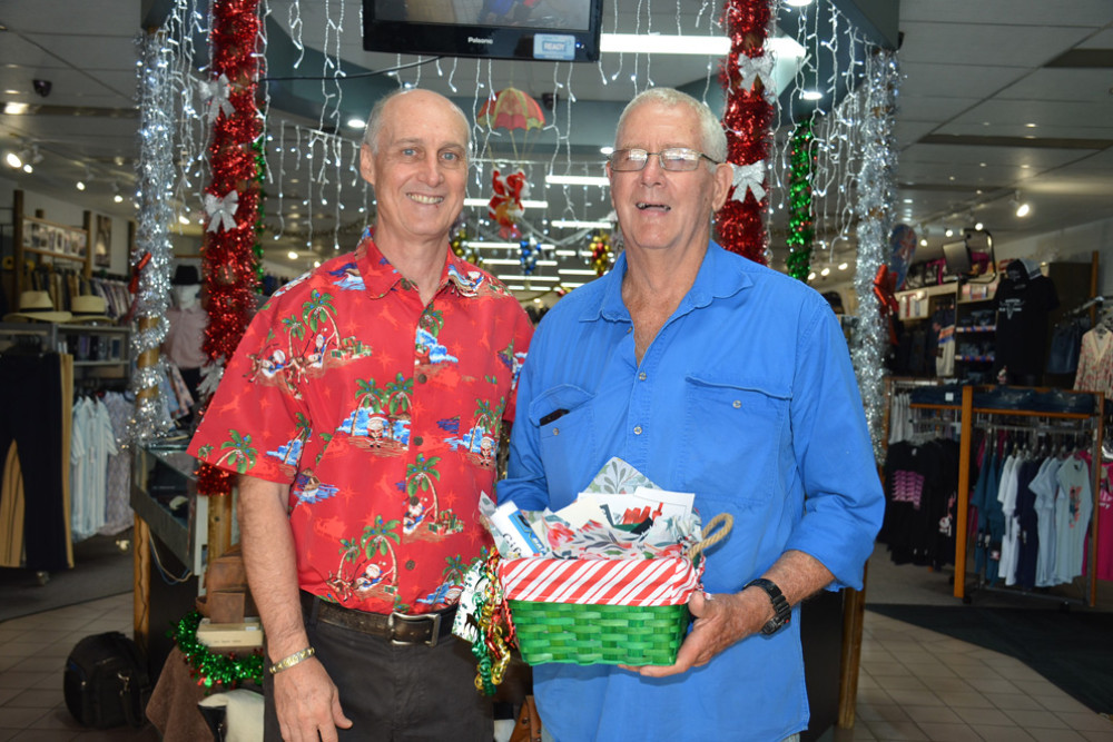 Robert Cater of Claude Cater Mensland with John Morris and his pack of vouchers