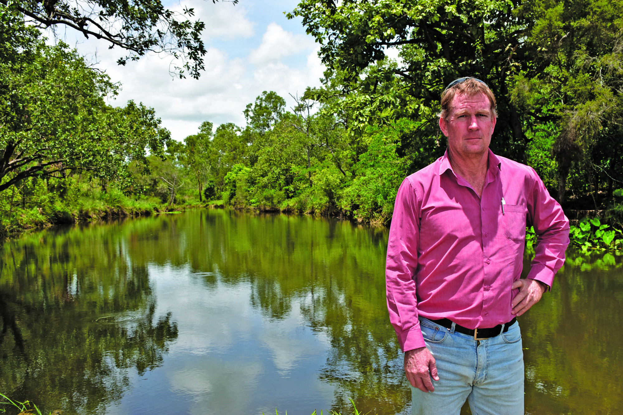 Mareeba Shire Council Deputy Mayor Kevin Davies standing in front of a now cleared Atherton Creek after the recent rains.