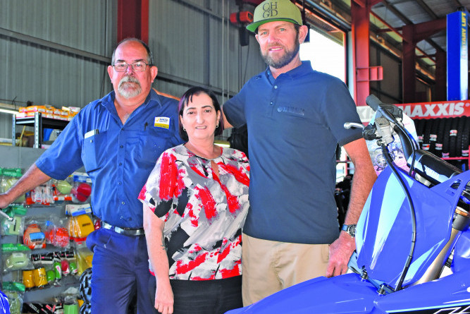Kevin and Lucy Dunn from Performance Motors with worker and president of the Mareeba Motorcycle Club Kim Grothues who will be hosting a special race day raising funds for the Dunn’s.
