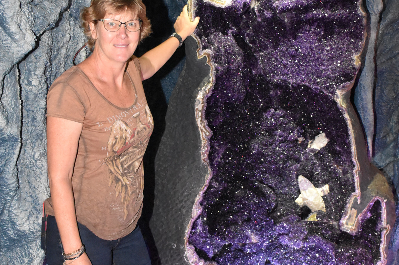 Ghis Gallo from the Crystal Caves in Atherton next to the world’s biggest Amethyst Geode