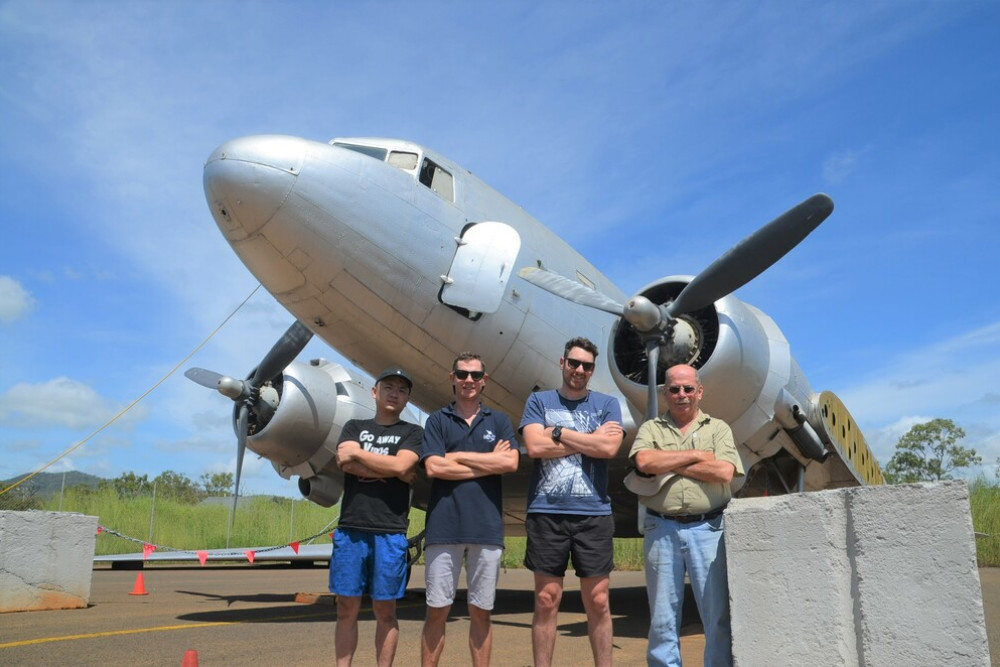 CELEBRATING 80 YEARS: FNQ Aviation Museum crew Leo Liu, Brendan Kent, Paul Hobson and David Falls in front o the Dakota C-47b which was written off in the 70’s after a landing accident in Townsville.