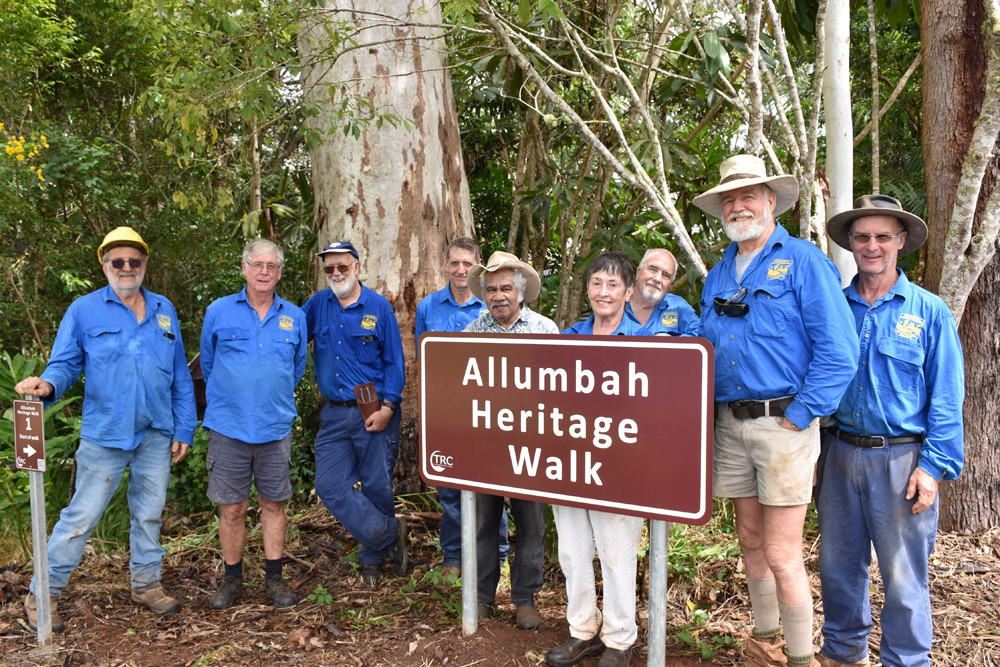 Members of the Yungaburra Landcare Group with the sign that marks the beginning of the new Allumbah Heritage Walk