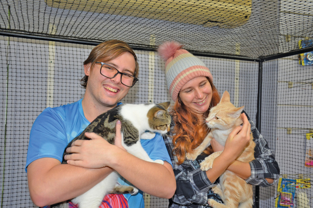 Fantasy Tails owner Zac Kroonenburg and Animal Refuge’s Felicity Pollard with resident cats Wanda and Pippi ready for their adoption event this weekend.