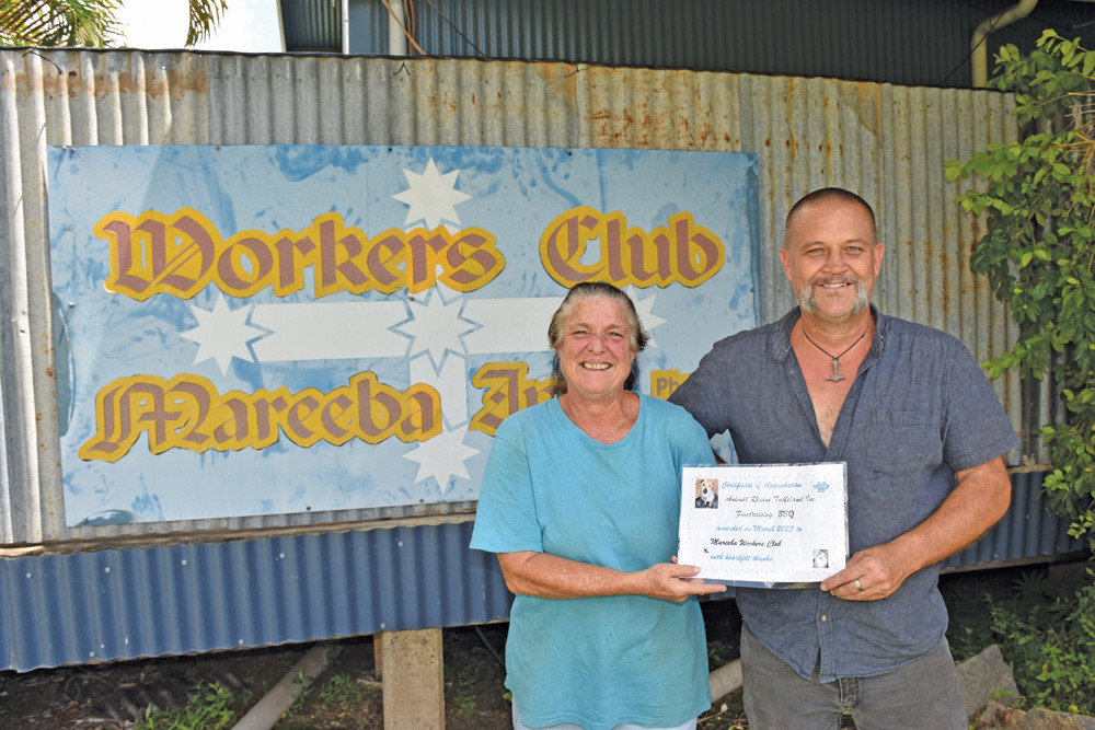 Animal Rescue Tablelands owner Sandy Brown presenting Glen from the Mareeba Workers Club with a certificate of appreciation.