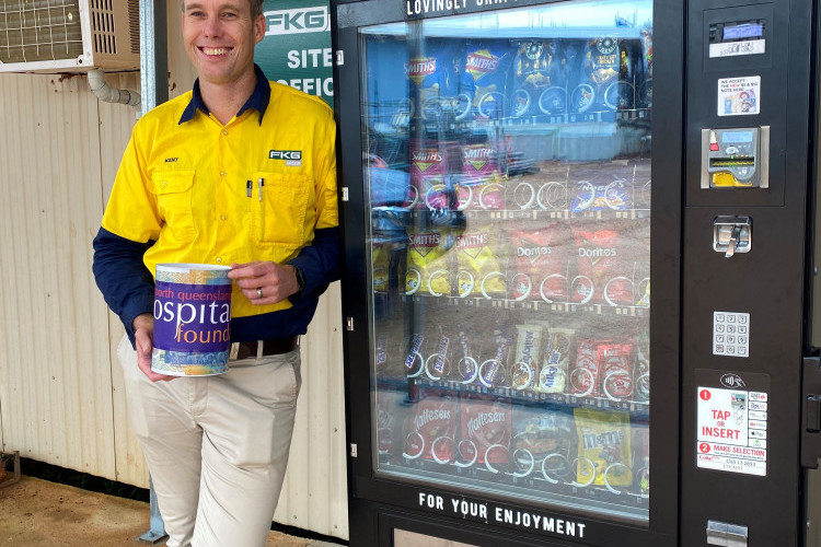 FKG Group Project Manager Kent Radnedge with the charity vending machine on-site of the Atherton Hospital redevelopment.