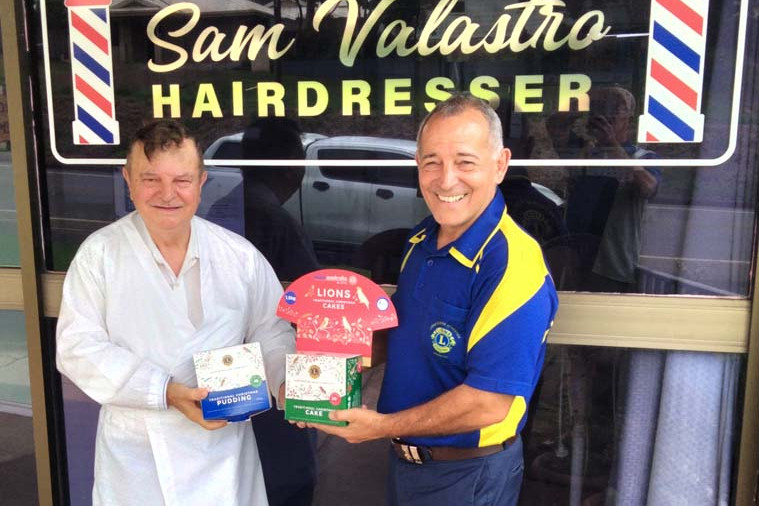 PICTURED: Sam Valastro has been thanked by Atherton Lions Christmas Cake coordinator Con Spanos for his ongoing dedication to the annual project.